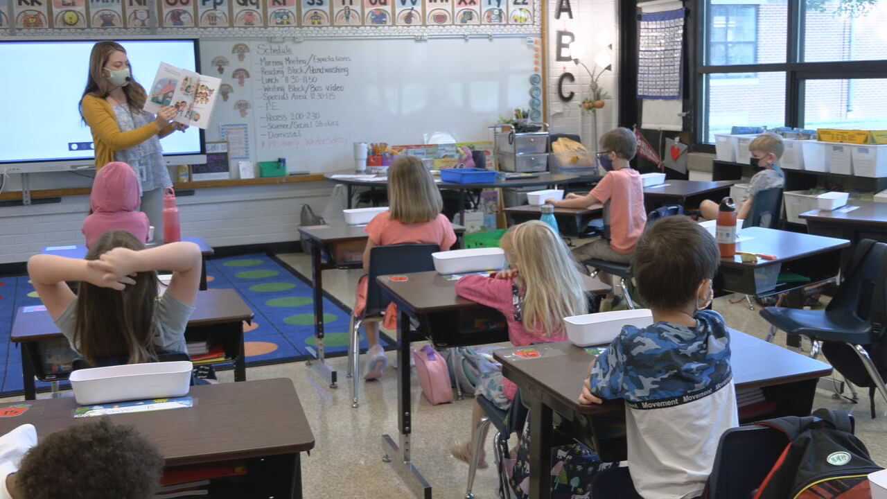 Masked teacher and students in class.jpeg